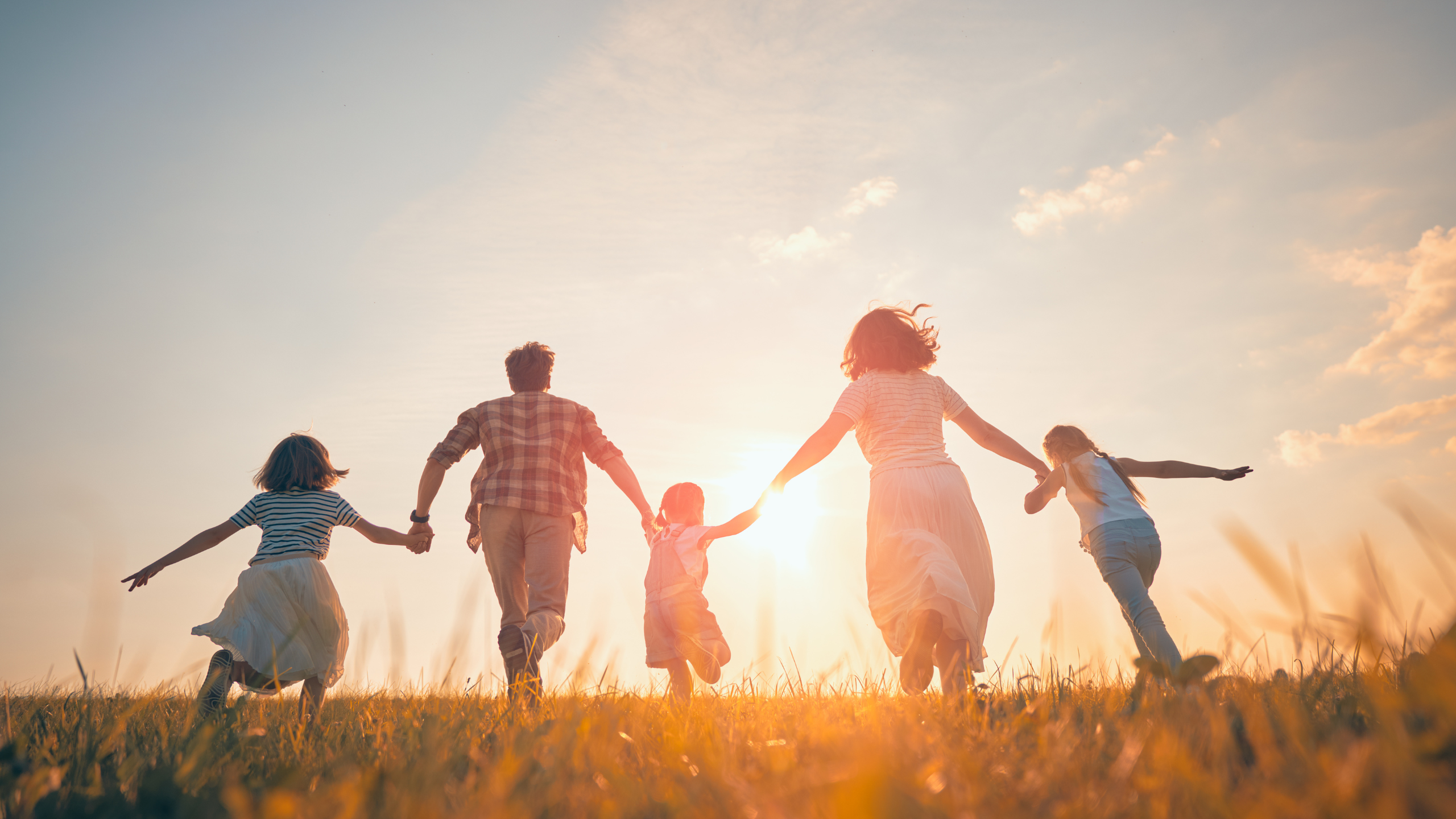family running toward the horizon